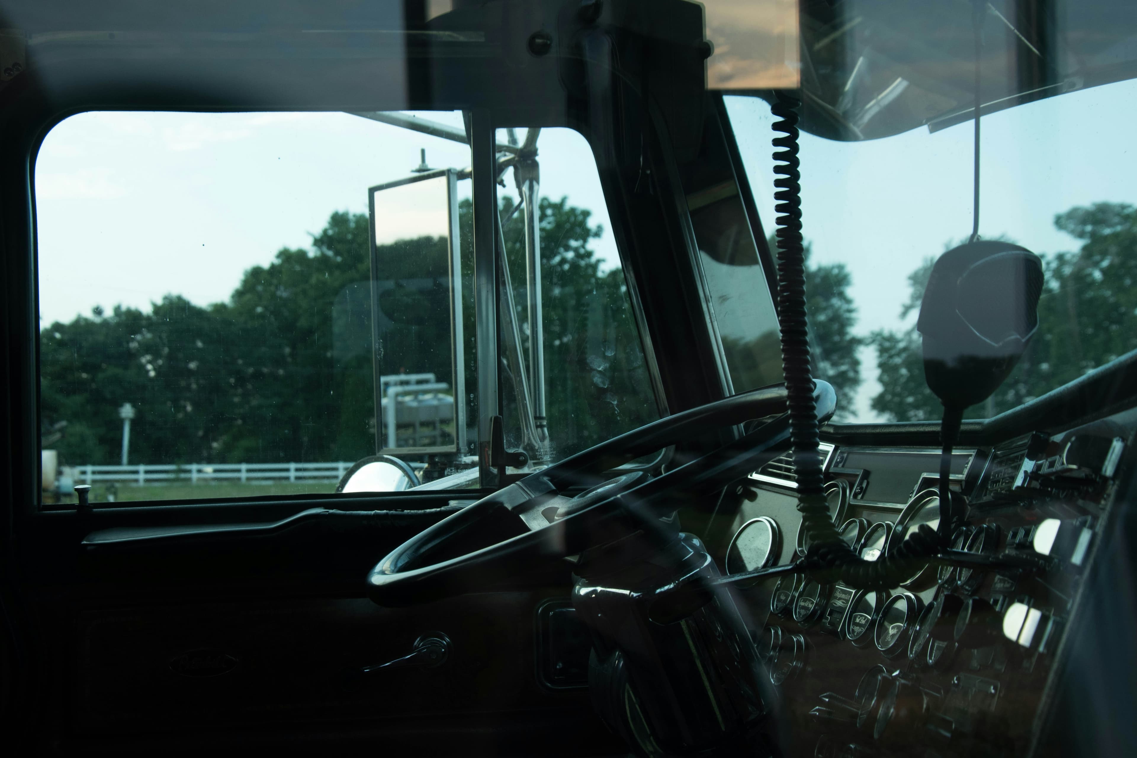 View from the driver seat of a conventional truck cab