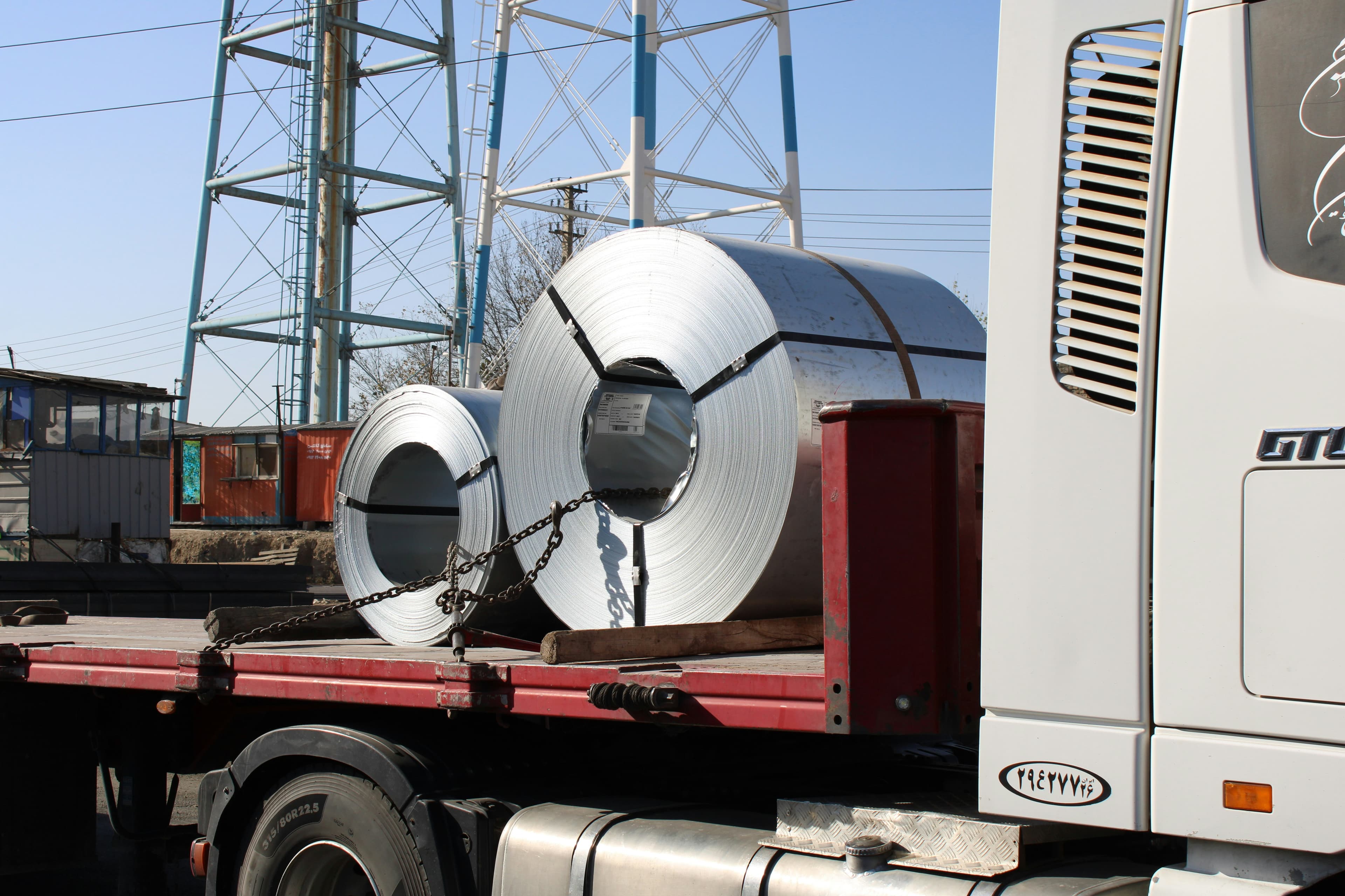 Steel coils chained down on a flatbed trailer
